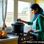 가정에서 쉽게 시도하는 에너지 절약 조리법 - A modern Pakistani kitchen scene showcasing energy-efficient cooking practices: a woman wearing mode...